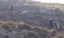 Çalılık alanda çıkan yangının ortasında kalan kadın itfaiye ekiplerince kurtarıldı
