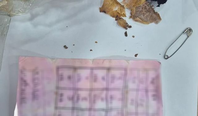 Yapı marketin raflarının arasında muska çıktı: 'Büyücülerin şerrinden Allah'a sığınırım'